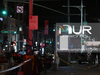 Evidence markers mark the scene where a police-involved shooting occurs in Jamaica, Queens, United States, on November 19, 2024. At 5:35 pm,...