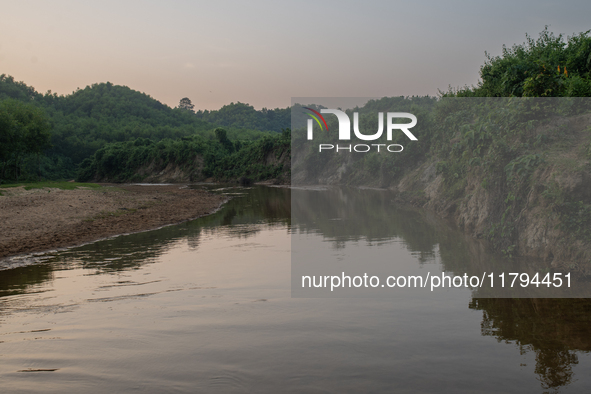 A view of a reservoir, locally called ''Jhiri,'' where water flows down from the mountain into the Jhiri. The mountains are not visible in t...