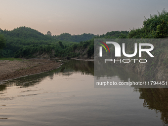 A view of a reservoir, locally called ''Jhiri,'' where water flows down from the mountain into the Jhiri. The mountains are not visible in t...