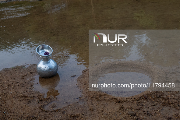 A water jar is near a reservoir locally called ''Jhiri'' in Durgapur, Netrokona, Bangladesh, on November 17, 2024. Locals create the circula...