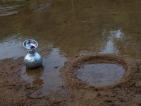 A water jar is near a reservoir locally called ''Jhiri'' in Durgapur, Netrokona, Bangladesh, on November 17, 2024. Locals create the circula...