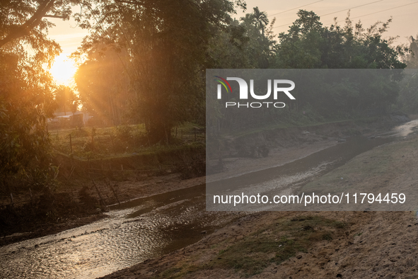 A view of a reservoir, locally called ''Jhiri,'' where water flows down from the mountain into the Jhiri. The mountains are not visible in t...