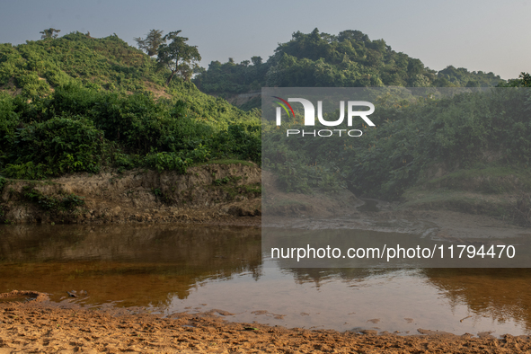 A view of a reservoir, locally called ''Jhiri,'' where water flows down from the mountain into the Jhiri. The mountains are not visible in t...