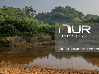 A view of a reservoir, locally called ''Jhiri,'' where water flows down from the mountain into the Jhiri. The mountains are not visible in t...