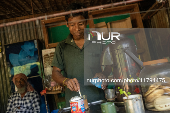 A tribal man makes tea at a local tea stall in Durgapur, Netrokona, Bangladesh, on November 17, 2024. Tea stalls serve as popular meeting po...