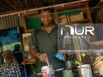 A tribal man makes tea at a local tea stall in Durgapur, Netrokona, Bangladesh, on November 17, 2024. Tea stalls serve as popular meeting po...