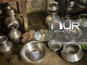 Water is stored in jars after being collected from the reservoir, locally known as ''Jhiri,'' in Durgapur, Netrokona, Bangladesh, on Novembe...