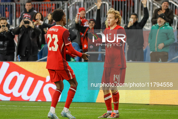 J. Shaffelburg #14 celebrates his goal with Ahmed #23 during the CONCACAF Nations League Quarter Final match between Team Canada and Surinam...