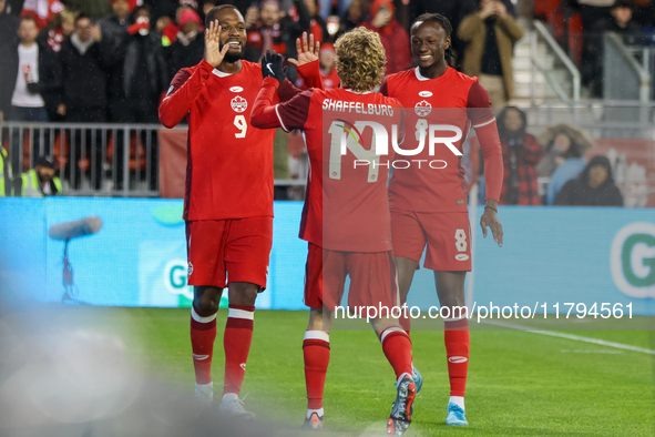 J. Shaffelburg #14 celebrates his second goal with C. Larin #9 and Ismael Kone #8 during the CONCACAF Nations League Quarter Final Match bet...