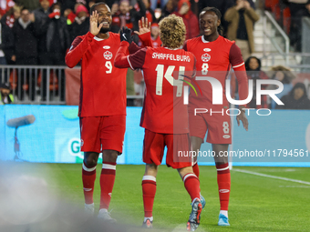 J. Shaffelburg #14 celebrates his second goal with C. Larin #9 and Ismael Kone #8 during the CONCACAF Nations League Quarter Final Match bet...