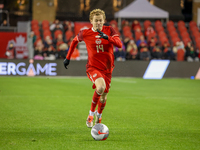 J. Shaffelburg #14 is in action during the CONCACAF Nations League Quarter Final match between Team Canada and Suriname at BMO Field in Toro...