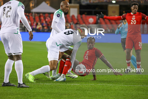 In Toronto, Ontario, Canada, on November 19, 2024, Richie Laryea battles with Justin Lonwijk #8 and other Suriname players during the CONCAC...