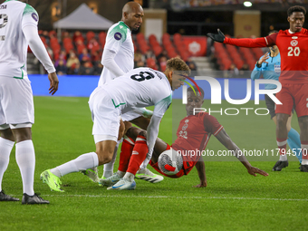 In Toronto, Ontario, Canada, on November 19, 2024, Richie Laryea battles with Justin Lonwijk #8 and other Suriname players during the CONCAC...