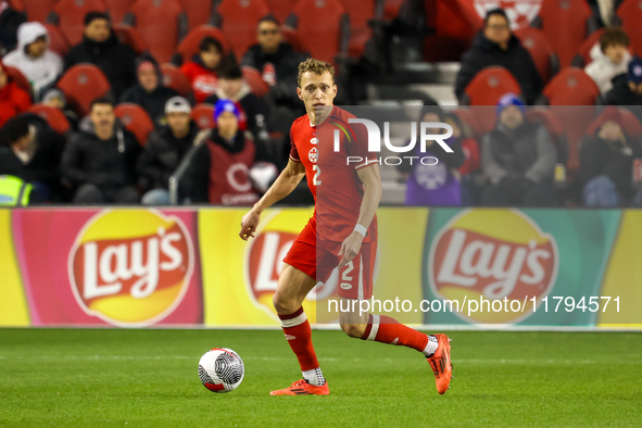 Alistair Johnston #2 is in action during the CONCACAF Nations League Quarter Final match between Team Canada and Suriname at BMO Field in To...