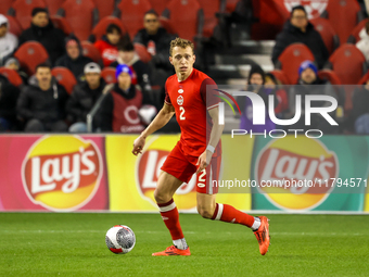 Alistair Johnston #2 is in action during the CONCACAF Nations League Quarter Final match between Team Canada and Suriname at BMO Field in To...