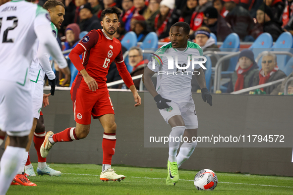 In Toronto, Ontario, Canada, on November 19, 2024, Gleofilo Vlijter #20 carries the ball while M. Choiniere #13 guards him during the CONCAC...