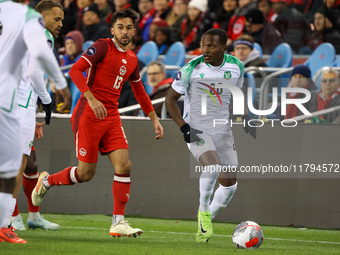 In Toronto, Ontario, Canada, on November 19, 2024, Gleofilo Vlijter #20 carries the ball while M. Choiniere #13 guards him during the CONCAC...