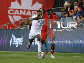 In Toronto, Ontario, Canada, on November 19, 2024, Richie Laryea #22 battles Sheraldo Becker #11 at the CONCACAF Nations League Quarter Fina...