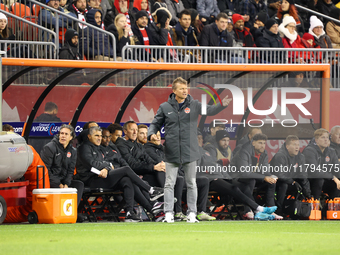 In Toronto, Ontario, Canada, on November 19, 2024, Team Canada's Head Coach Jesse Marsch gives instruction in front of the team bench at the...