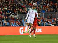 Justin Lonwijk #8 heads the ball at the CONCACAF Nations League Quarter Final match between Team Canada and Suriname at BMO Field in Toronto...