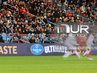 Fans watch the game while the Maple Lodge brand is spotted at the CONCACAF Nations League Quarter Final Match between Team Canada and Surina...