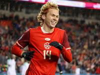 Jacob Shaffelburg #14 celebrates his second goal at the CONCACAF Nations League Quarter Final Match between Team Canada and Suriname at BMO...