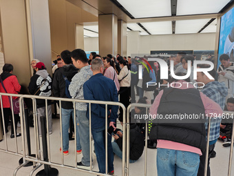 Customers who order Mate X6 foldable screen phones line up in batches at Huawei's global flagship store in Shanghai, China, on November 20,...