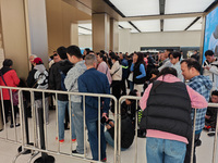 Customers who order Mate X6 foldable screen phones line up in batches at Huawei's global flagship store in Shanghai, China, on November 20,...