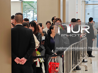 Customers who order Mate X6 foldable screen phones line up in batches at Huawei's global flagship store in Shanghai, China, on November 20,...