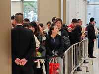 Customers who order Mate X6 foldable screen phones line up in batches at Huawei's global flagship store in Shanghai, China, on November 20,...