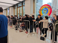 Customers who order Mate X6 foldable screen phones line up in batches at Huawei's global flagship store in Shanghai, China, on November 20,...