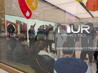 Customers who order Mate X6 foldable screen phones line up in batches at Huawei's global flagship store in Shanghai, China, on November 20,...