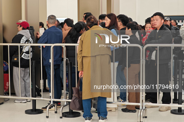 Customers who order Mate X6 foldable screen phones line up in batches at Huawei's global flagship store in Shanghai, China, on November 20,...