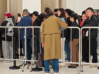 Customers who order Mate X6 foldable screen phones line up in batches at Huawei's global flagship store in Shanghai, China, on November 20,...