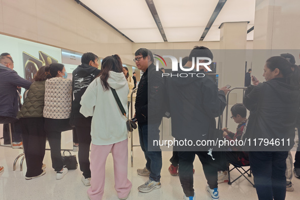 Customers who order Mate X6 foldable screen phones line up in batches at Huawei's global flagship store in Shanghai, China, on November 20,...