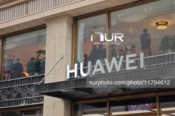 Customers who order Mate X6 foldable screen phones line up in batches at Huawei's global flagship store in Shanghai, China, on November 20,...