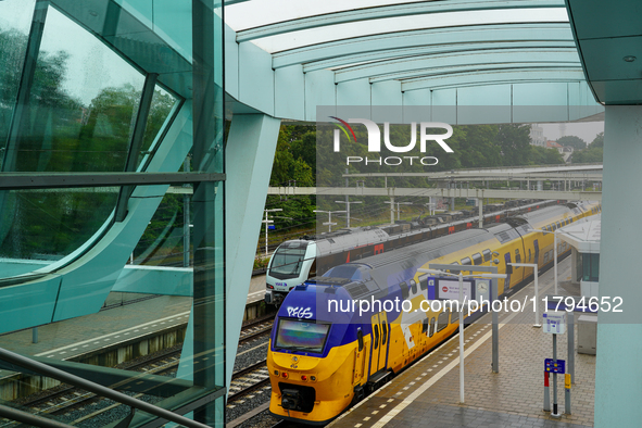 Arnhem Centraal train station in Arnhem, Netherlands, on July 27, 2023, presents a striking view of modern Dutch rail infrastructure. A brig...