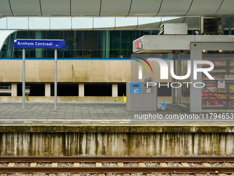 In Arnhem, Netherlands, on July 27, 2023, Arnhem Central Station captures the activity on one of the platforms. A man sorts through a recycl...