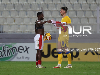 In Ta' Qali, Malta, on November 19, 2024, Basil Tuma of Malta and Christian Garcia of Andorra shake hands after the UEFA Nations League, Lea...