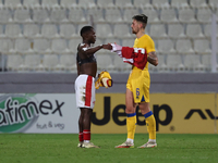 In Ta' Qali, Malta, on November 19, 2024, Basil Tuma of Malta and Christian Garcia of Andorra shake hands after the UEFA Nations League, Lea...