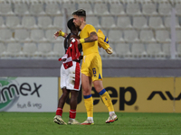 In Ta' Qali, Malta, on November 19, 2024, Basil Tuma of Malta and Christian Garcia of Andorra embrace each other after the UEFA Nations Leag...