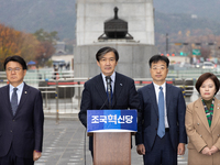 Cho Kuk, leader of the Rebuilding Korea Party, along with party lawmakers, holds a press conference in front of the Admiral Yi Sun-sin statu...