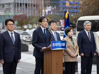 Cho Kuk, leader of the Rebuilding Korea Party, along with party lawmakers, holds a press conference in front of the Admiral Yi Sun-sin statu...