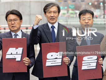 Cho Kuk, leader of the Rebuilding Korea Party, along with party lawmakers, chants slogans during a press conference in front of the Admiral...