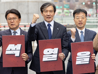 Cho Kuk, leader of the Rebuilding Korea Party, along with party lawmakers, chants slogans during a press conference in front of the Admiral...