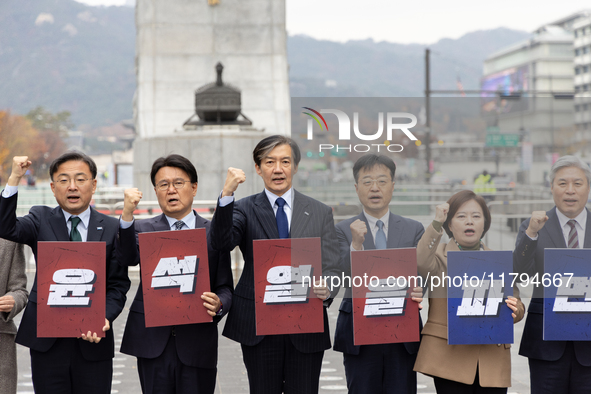 Cho Kuk, leader of the Rebuilding Korea Party, along with party lawmakers, chants slogans during a press conference in front of the Admiral...