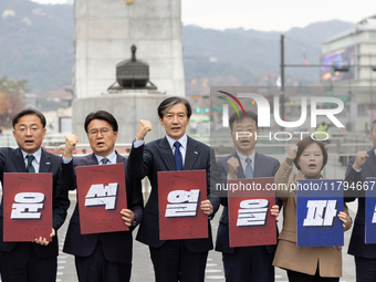 Cho Kuk, leader of the Rebuilding Korea Party, along with party lawmakers, chants slogans during a press conference in front of the Admiral...