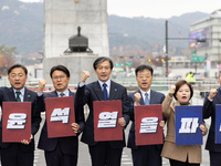 Cho Kuk, leader of the Rebuilding Korea Party, along with party lawmakers, chants slogans during a press conference in front of the Admiral...