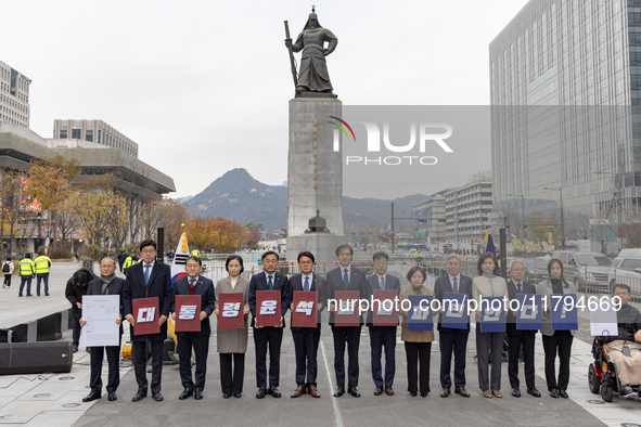 Cho Kuk, leader of the Rebuilding Korea Party, along with party lawmakers, holds a press conference in front of the Admiral Yi Sun-sin statu...