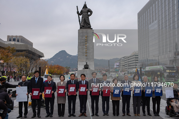 Cho Kuk, leader of the Rebuilding Korea Party, along with party lawmakers, holds a press conference in front of the Admiral Yi Sun-sin statu...